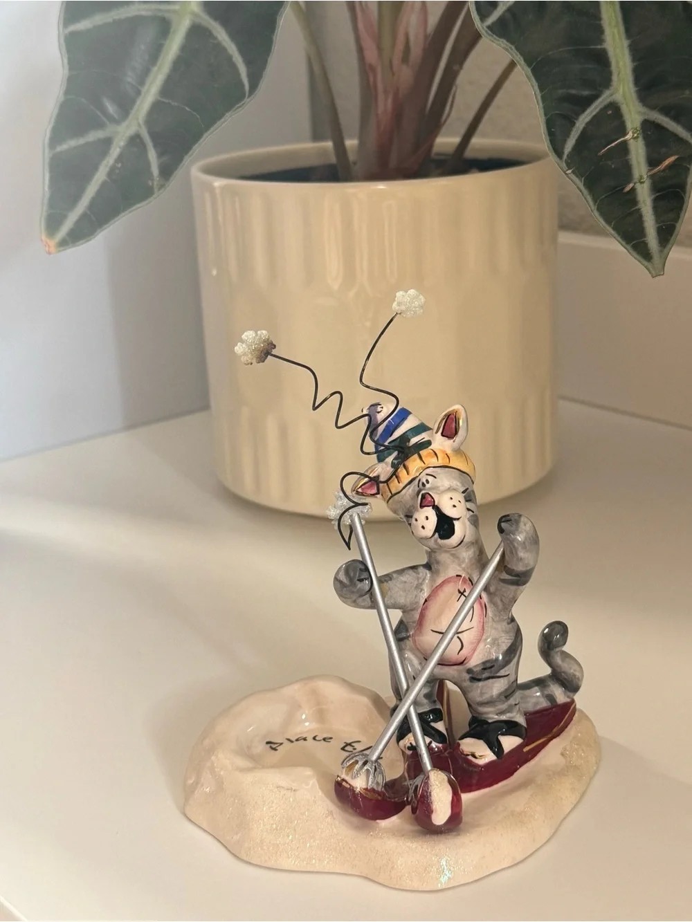 Blue Sky Heather Goldminc Ceramic Cat Skiing Figurine - Cream Base, Red Accents